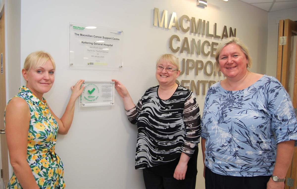 Macmillan team with plaque