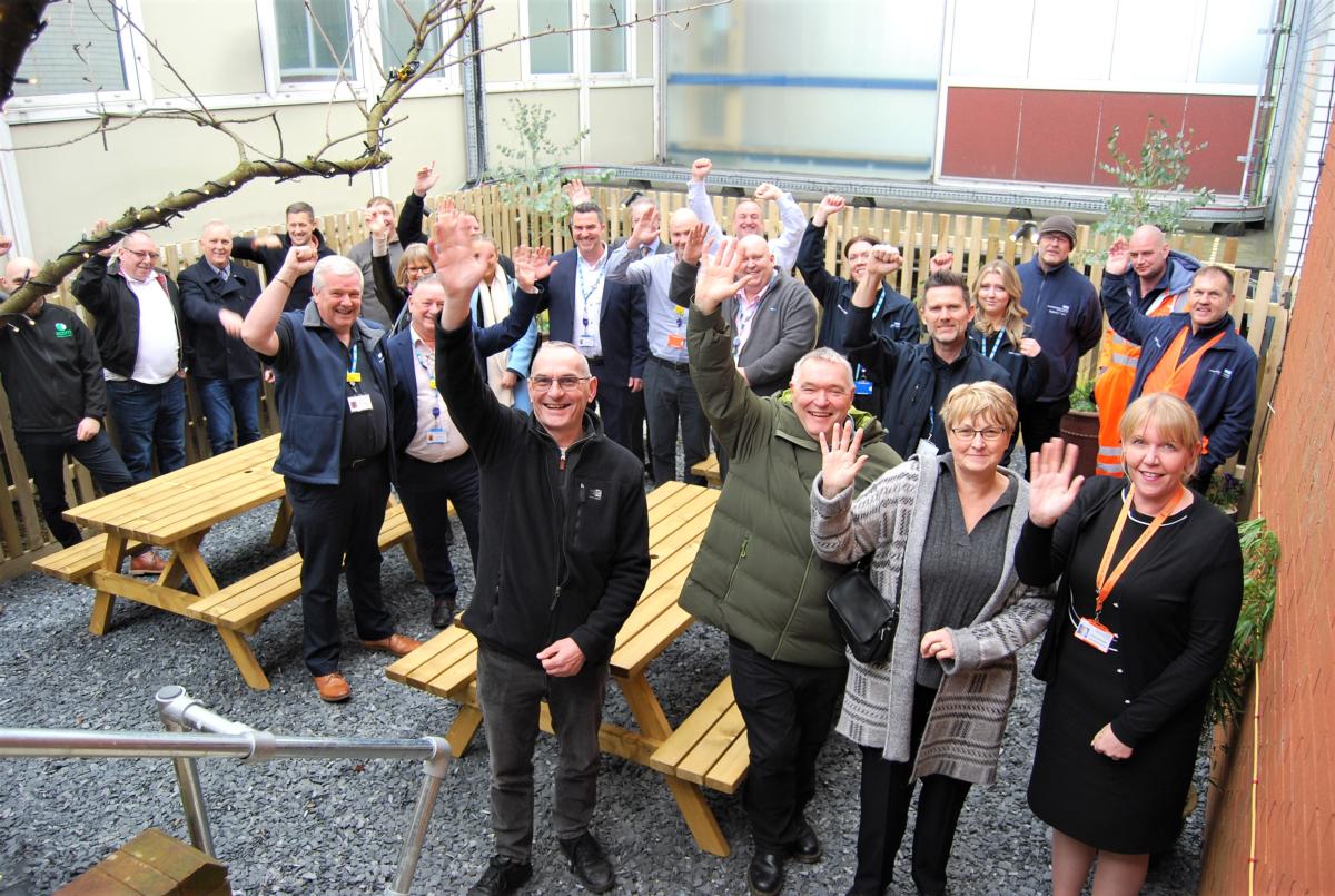 Chris Martyn and Debbie Howe front with CEO Deborah Needham and estates team celebrate opening